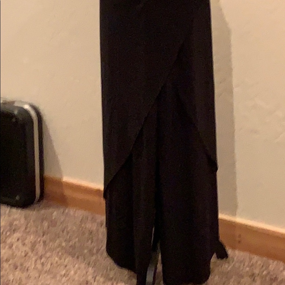 Pants with long flap half skirt symmetric